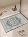 Decorative bath mat with intricate patterns in a bathroom setting.