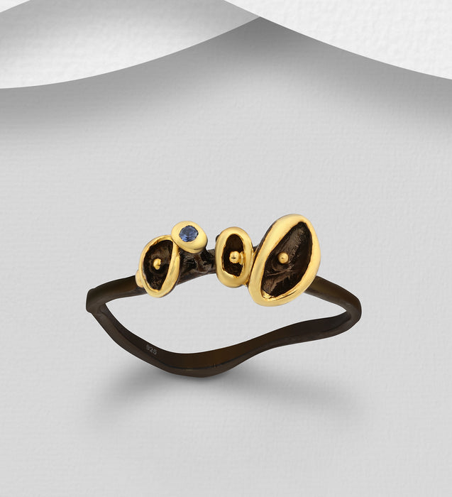 e Sterling Silver Ring Decorated with Blue Sapphires, Plated with 3 Micron 22K Yellow Gold and Black Rhodium
