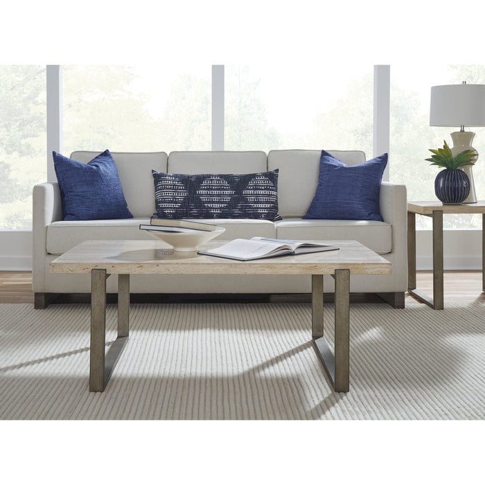 Ariela coffee table made of natural travertine with a bronze-colored metal base
