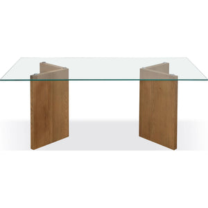 A modern coastal-style dining table with a glass top made of white oak.