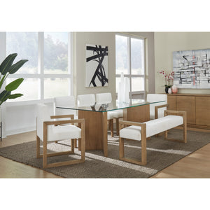 A modern coastal-style dining table with a glass top made of white oak.