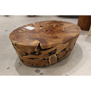 One Teak Slice coffee table made of solid wood in warm teak