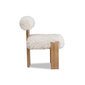 Nia dining chair with sheepskin and lioness accents