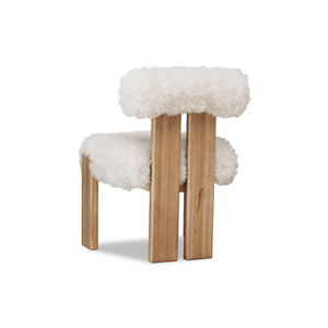 Nia dining chair with sheepskin and lioness accents