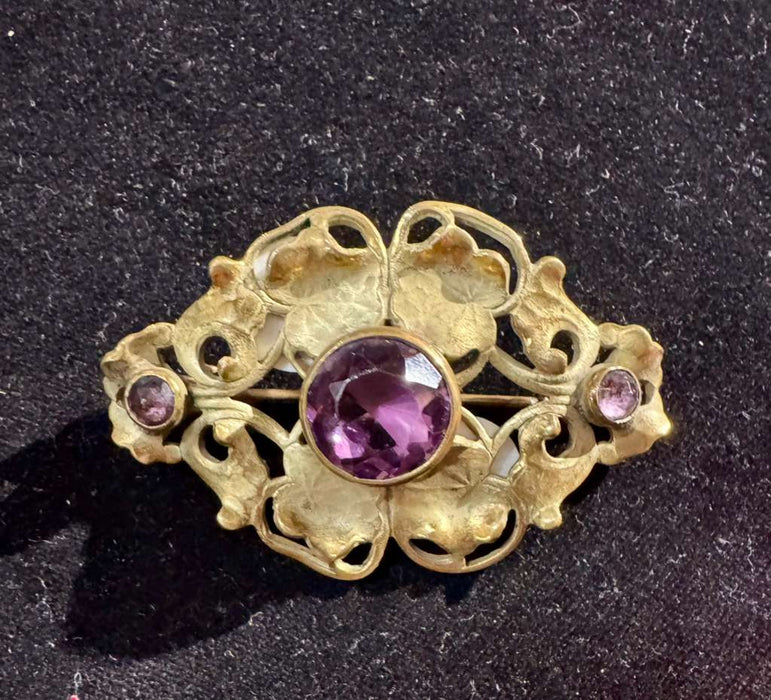 Vintage leaf with purple stone