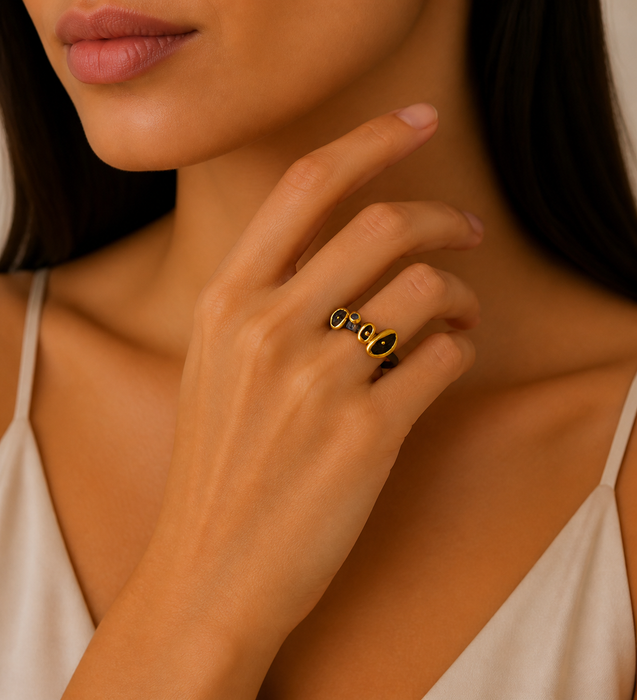 e Sterling Silver Ring Decorated with Blue Sapphires, Plated with 3 Micron 22K Yellow Gold and Black Rhodium